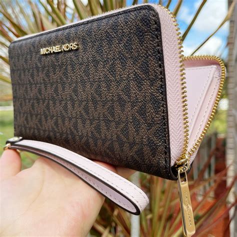 michael kors phone wristlet leather|Michael Kors oversized wallet.